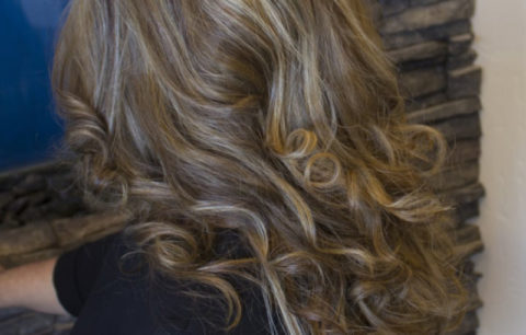 Ash brown curls with subtle lighter pieces, back view