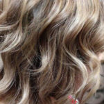 Ash blonde curls with highlights