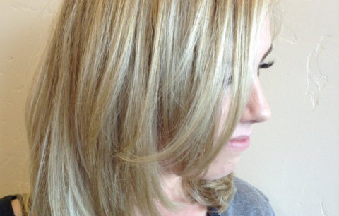Layered blonde hair with bright pieces around the face